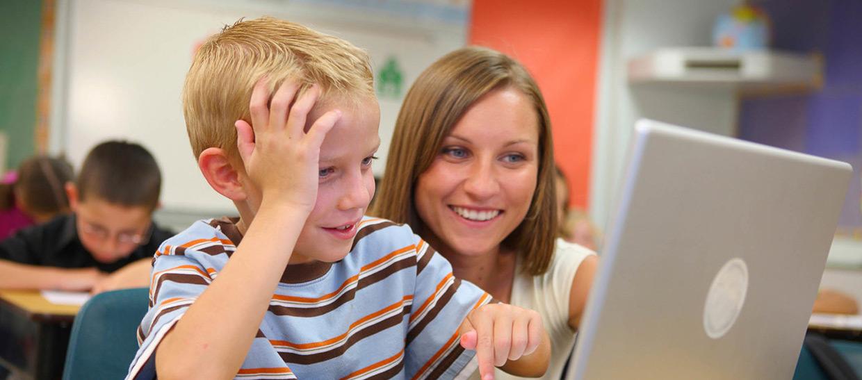 Teacher and child in a classroom